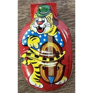 VINTAGE - TIN LITHO - 1960'S - - CLICKER - TIGER PLAYING INSTRUMENT - JAPAN -